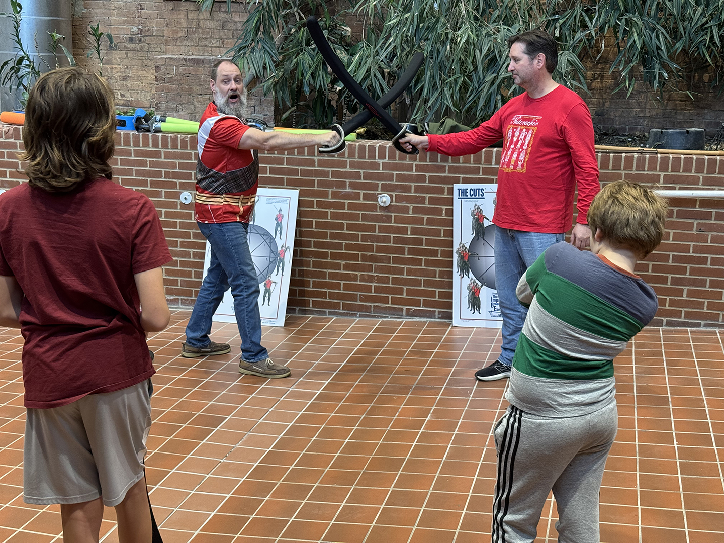 Joe Long and Bentley Coffey demonstrate some of the finer points to the class image